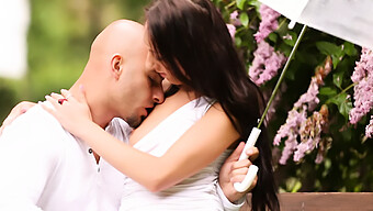 A Pair Enjoys Pleasure In The Open Air On A Park Bench