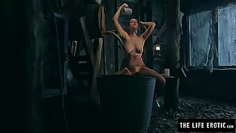 A busty mature woman pleasures herself in a dilapidated dwelling