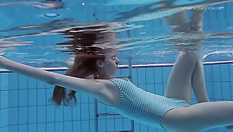 Slender European teen Anna Netrebko swims in public pool